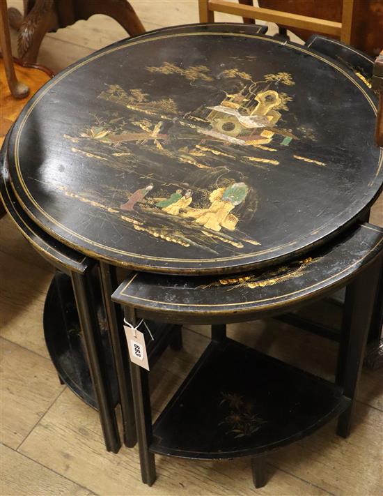 A nest of chinoiserie lacquer tea tables W.67cm diameter